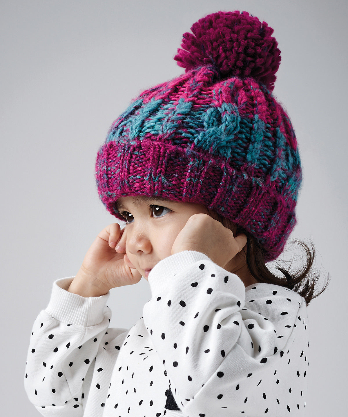 Junior corkscrew pom pom beanie