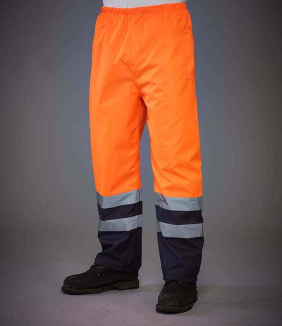 Yoko Hi-Vis Two Tone Waterproof Overtrousers | Orange/Navy Trousers Yoko hi-vis, Hi-vis Adult, Hi-vis Reflective Border Kids Waistcoat, Hi-vis Tops, Hi-Viz Premium P.E. Bag, style-yk217, workwear, Yoko Schoolwear Centres